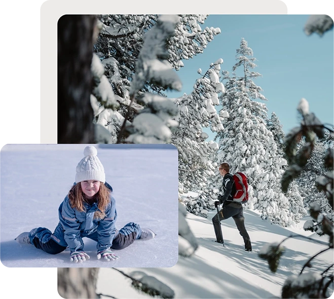 Girl making handprints in snow and man snowshoe hiking