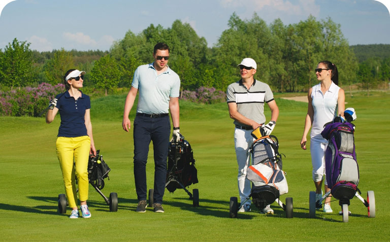 Group of friends walking down fairway