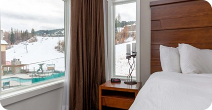 Bedroom with view of ski hill